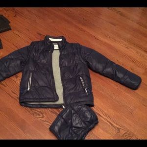 Mini-Boden boys navy puffer, fleece-lined.